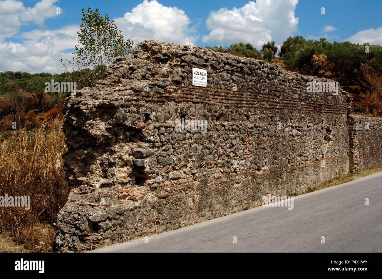 REPUBLIC OF ALBANIA. Stretch of wall along the road between Saranda and Mesopotam. Stock Photo