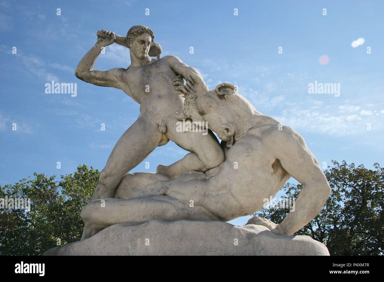 Classical Mythologi. Theseus slaying Minotaur. Statue 19th century AD. The Garden of the Tulleria (Tuileries). Paris. France. Europe. Stock Photo