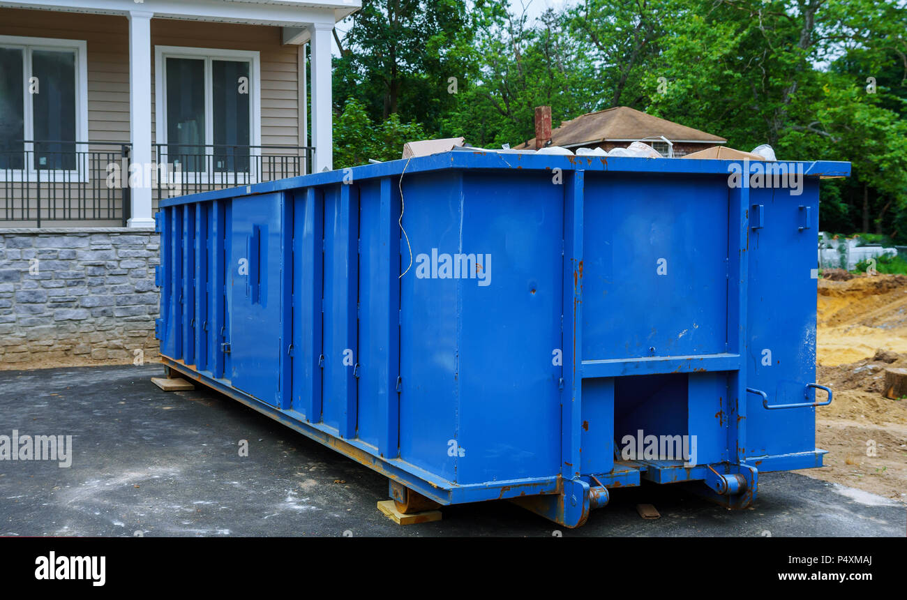 Full construction rubbish bin with loads at construction site waste