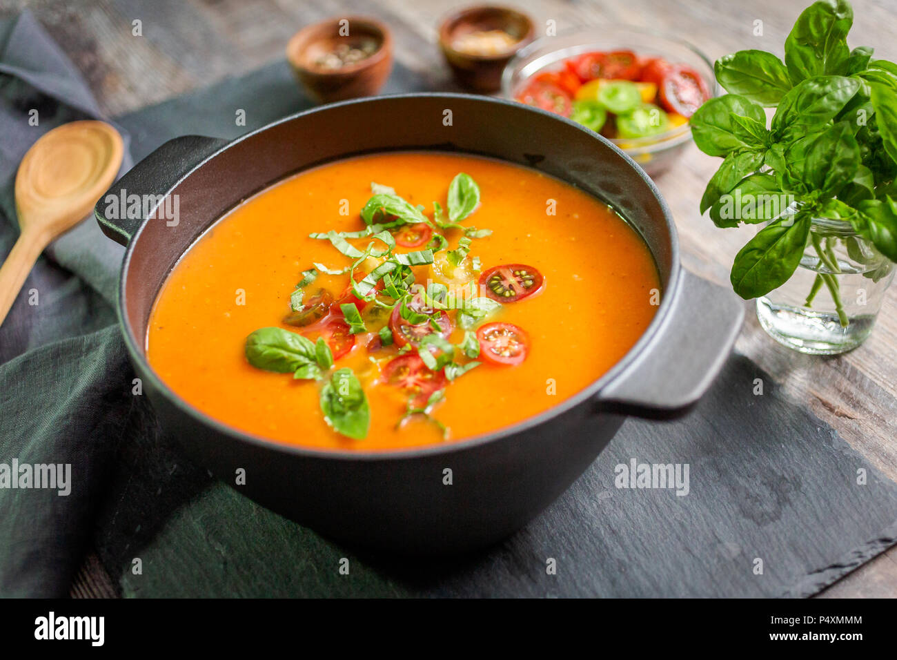 Roasted tomato soup in cast iron cooking pot Stock Photo - Alamy