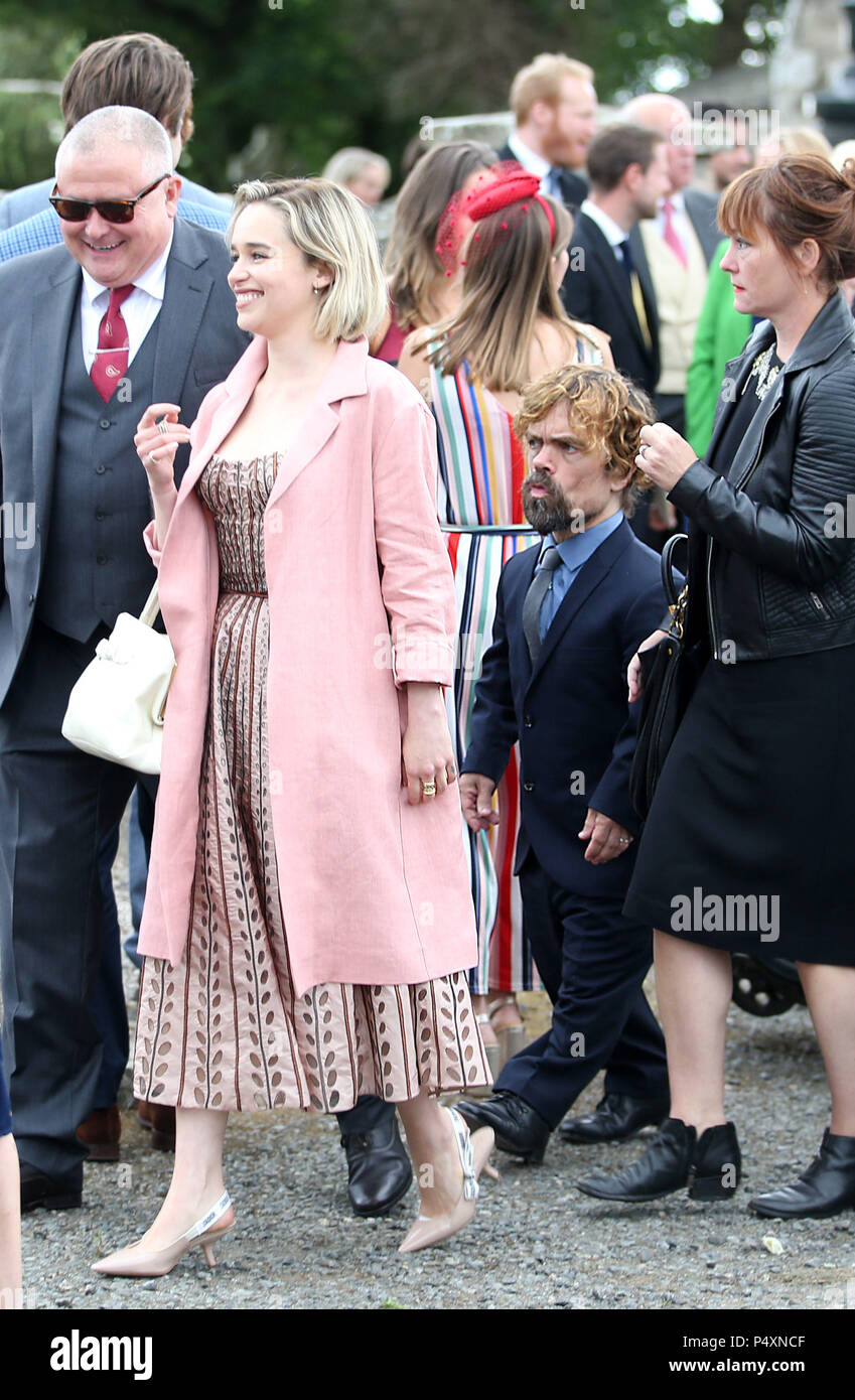 Actors Emilia Clarke, followed by Peter Dinklage leave Rayne Church,  Kirkton of Rayne in Aberdeenshire, after the wedding ceremony of Game Of  Thrones stars Kit Harington and Rose Leslie Stock Photo -