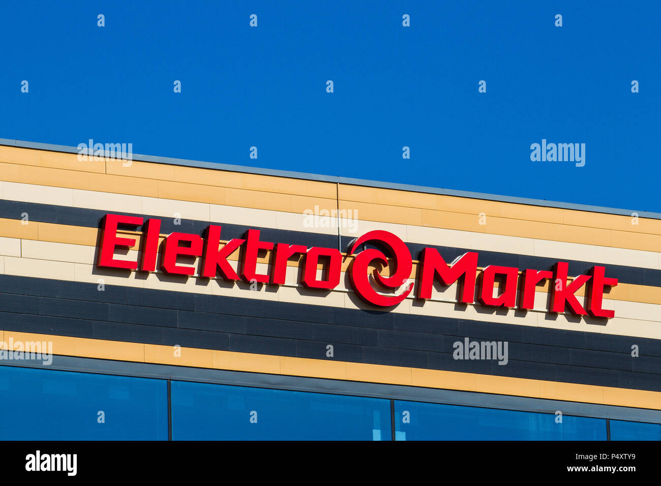 Elekromarkt logo and sign on the shopping center. Elektromarkt is one of the biggest retail chains of electronics and home appliances in Baltic States. Stock Photo