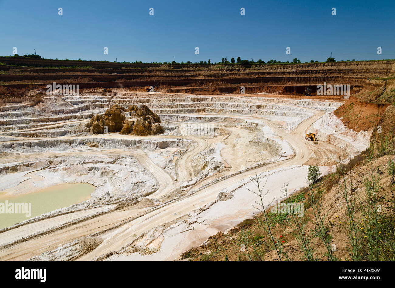 Stone quarry with excavate - Open pit mine Stock Photo