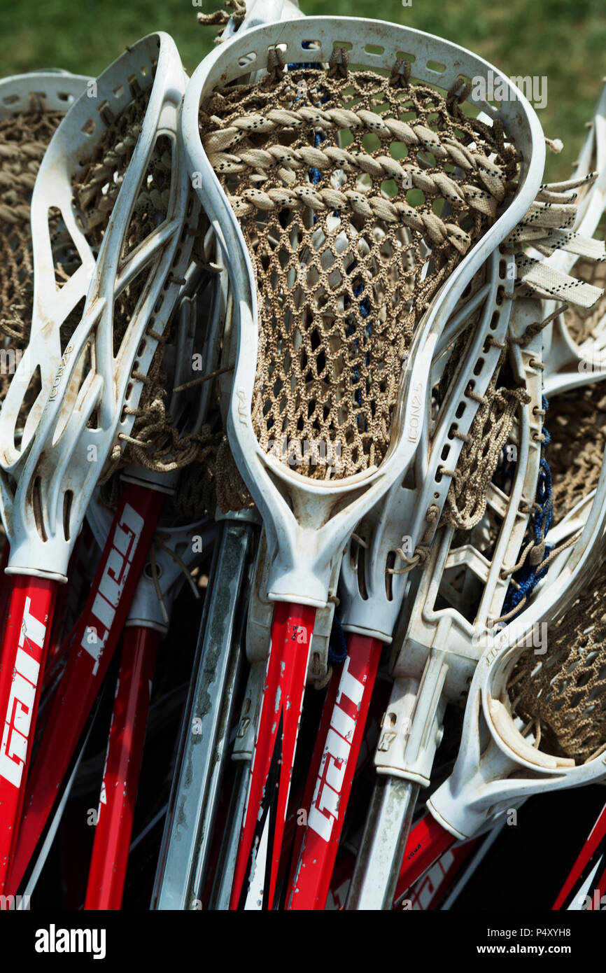 Lacrosse sticks in container after game. Stock Photo