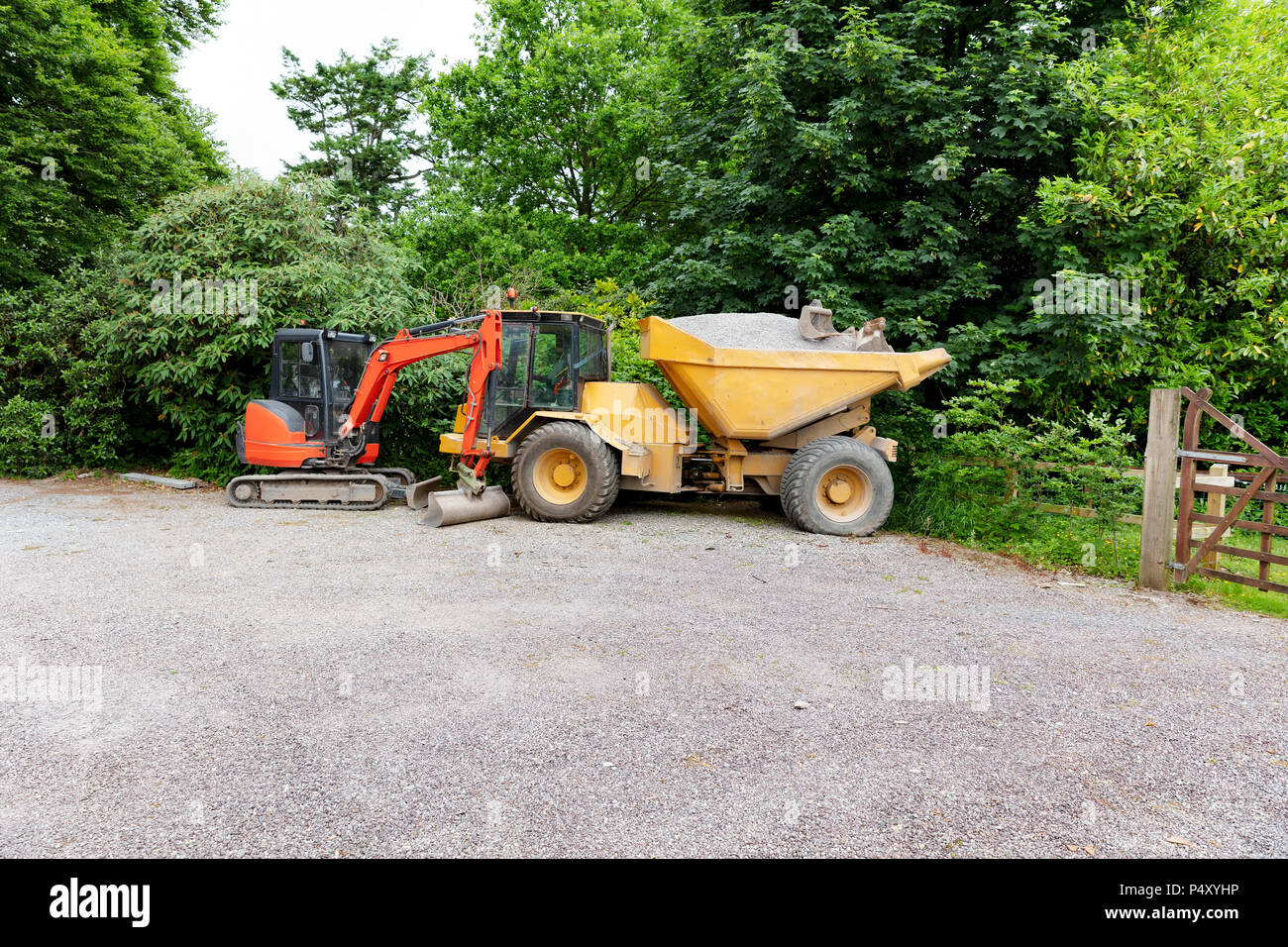 Construction equipment on job location with stone for road work Stock Photo