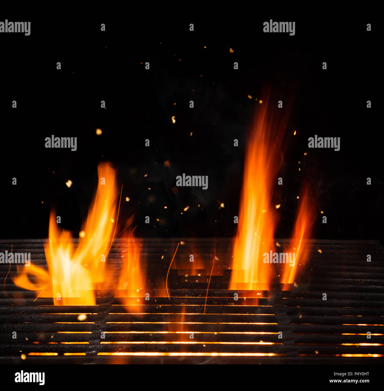 Empty grill with cast-iron and flames, ideal for product placement. Very high resolution image Stock Photo