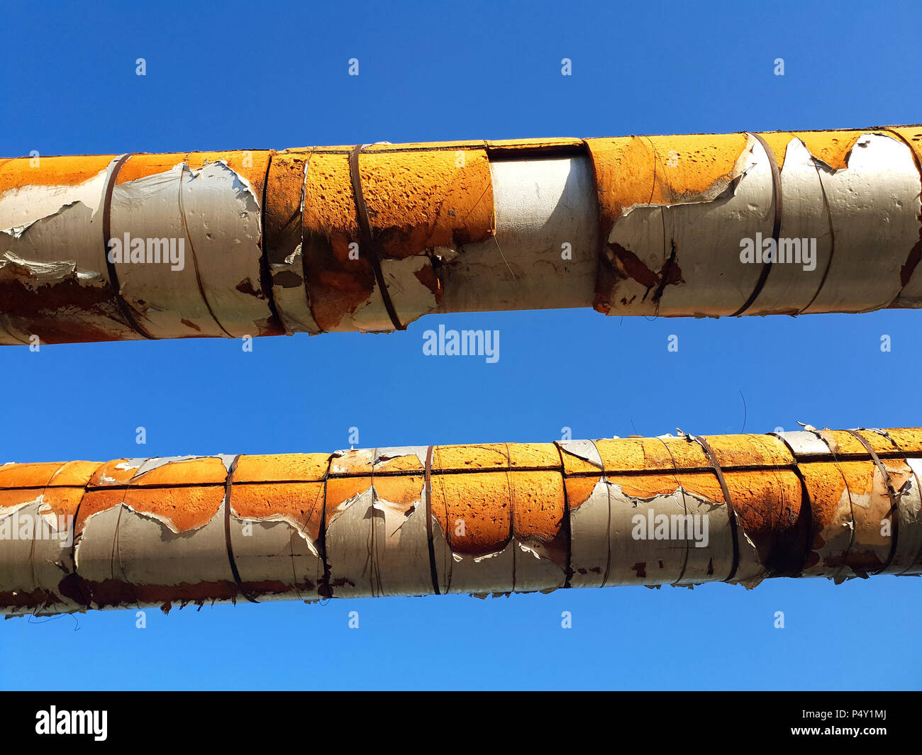 old pipes of above-ground heating main in heater Stock Photo