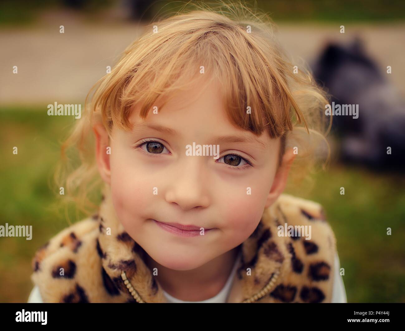 Portrait of a beautiful smiling little girl close-up outdoor Stock ...