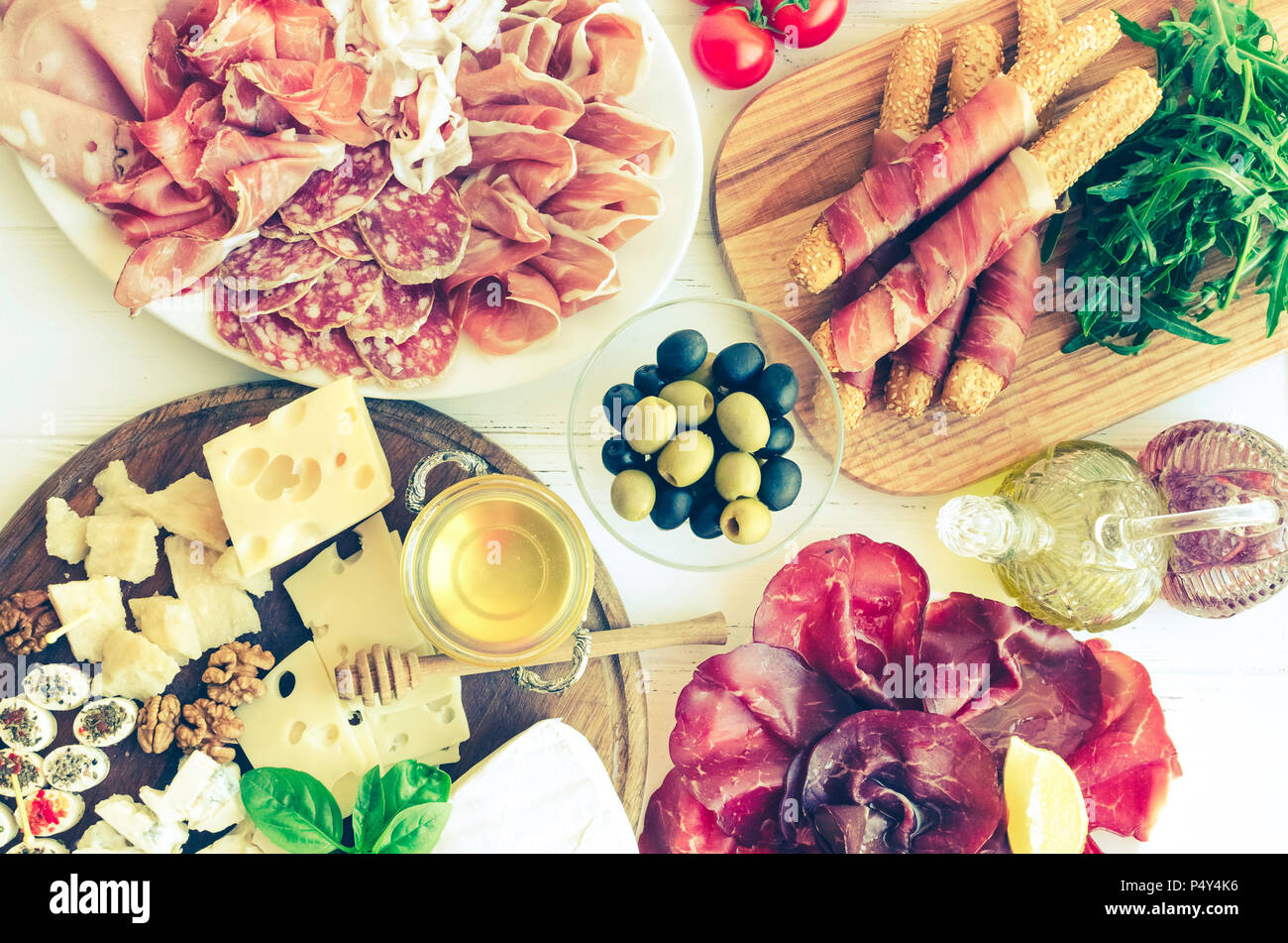 Table full of mediterranean appetizers, tapas or antipasto. Assorted ...