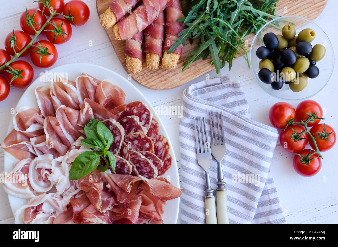 Table full of mediterranean appetizers, tapas or antipasto. Assorted ...