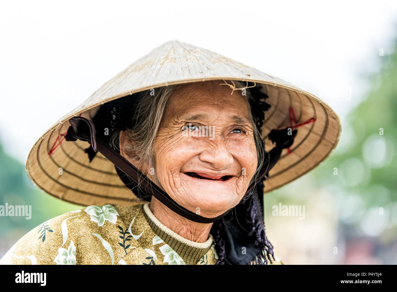 Old friendly woman with vietnamese straw hat Stock Photo Alamy