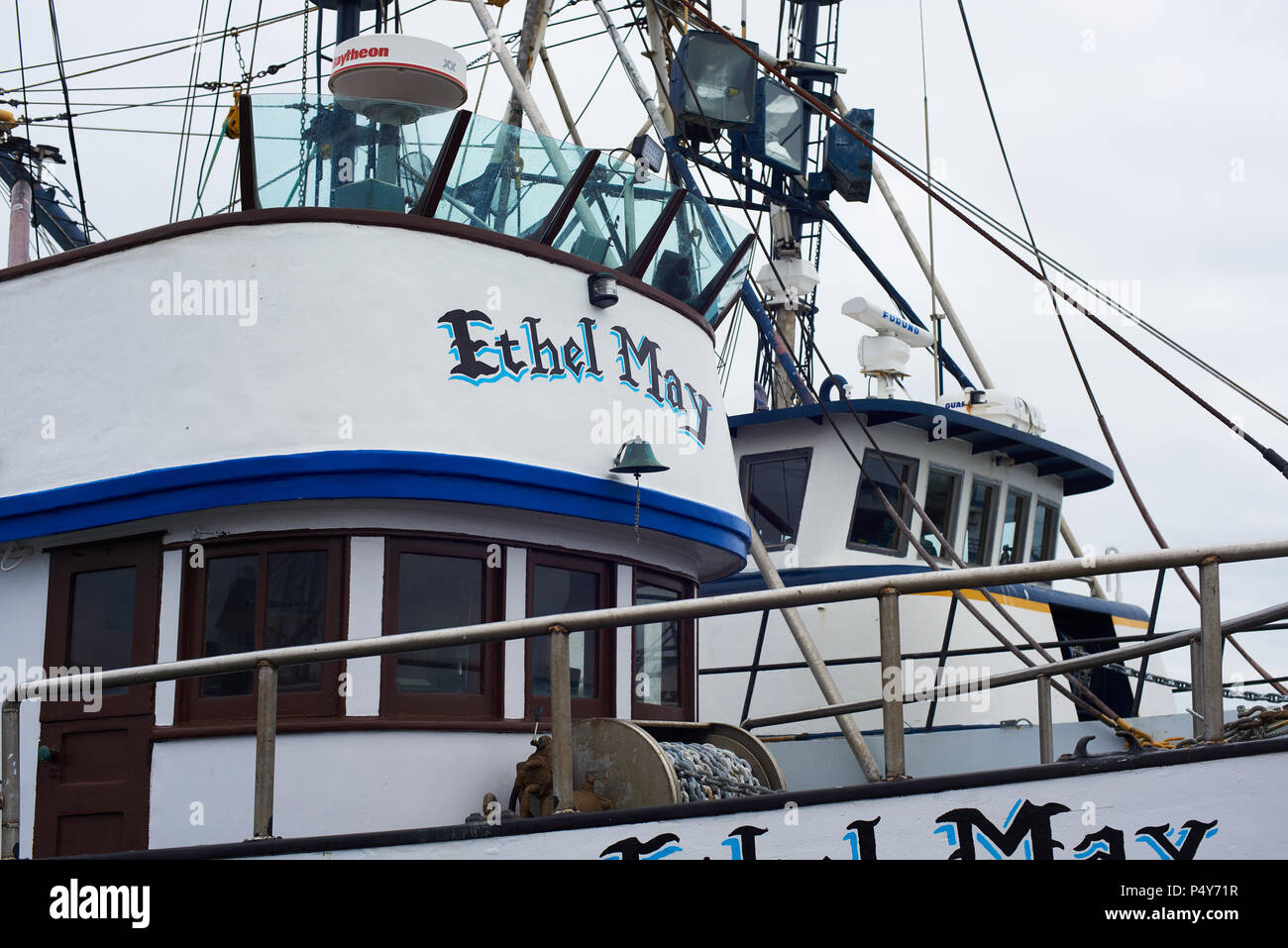 Fishing boat skipper checks the GPS receiver on a fishing boat in the  Pacific Ocean off the coast of Westport, Washington, USA Stock Photo - Alamy