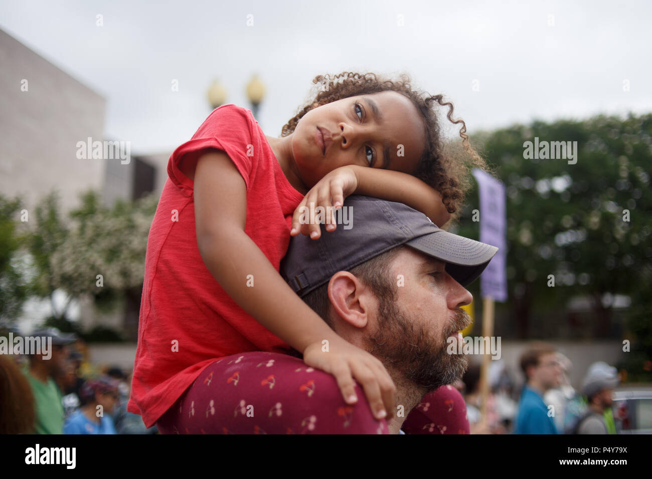 Washington, USA. 23rd June, 2018. A young protestor rests her head during the Stand Aganst Poverty March. The event is organized by the Poor People's Campaign, led by Rev. William Barber and Rev. Liz Theoharis and reviving a mission led by Dr. Martin Luther King, Jr. Credit: Michael Candelori/Pacific Press/Alamy Live News Stock Photo