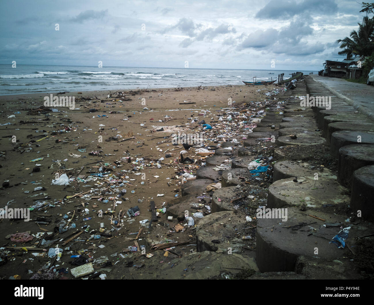 Plastic bags, bottles and other trash polluting beach in Sumatra, Indonesia Stock Photo