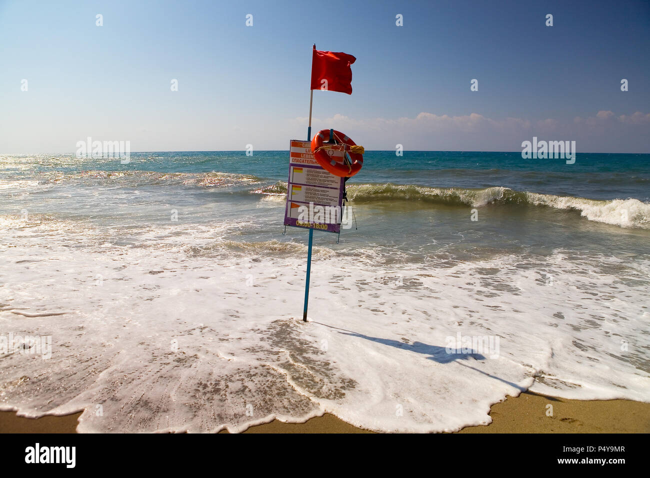 Red flag on the beach, meaning that swimming is dangerous. Turkey Stock