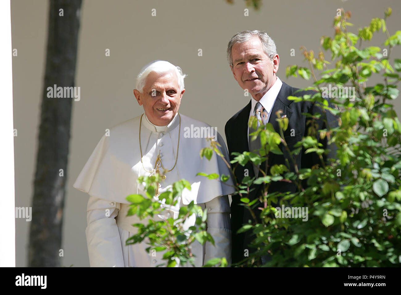 President George W. Bush and Pope Benedict XVI pause along the White House Colonnade to look at the Rose Garden on their way for a meeting in the Oval Office Wednesday, April 16, 2008, following the Pope's welcoming ceremony on the South Lawn of the White House. Stock Photo