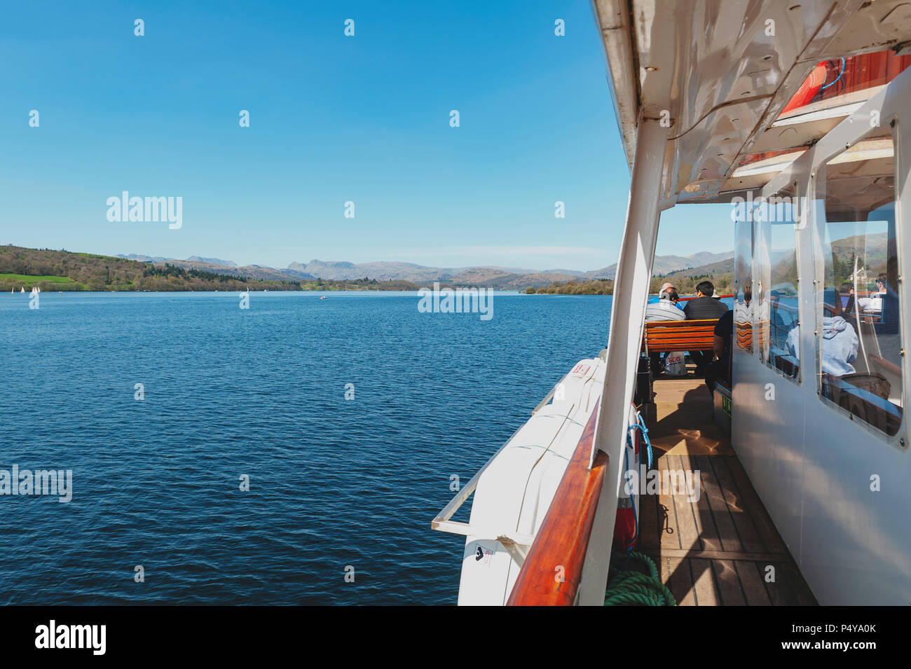 Tourists enjoying boat cruise at Lake Windermere from Bownesson