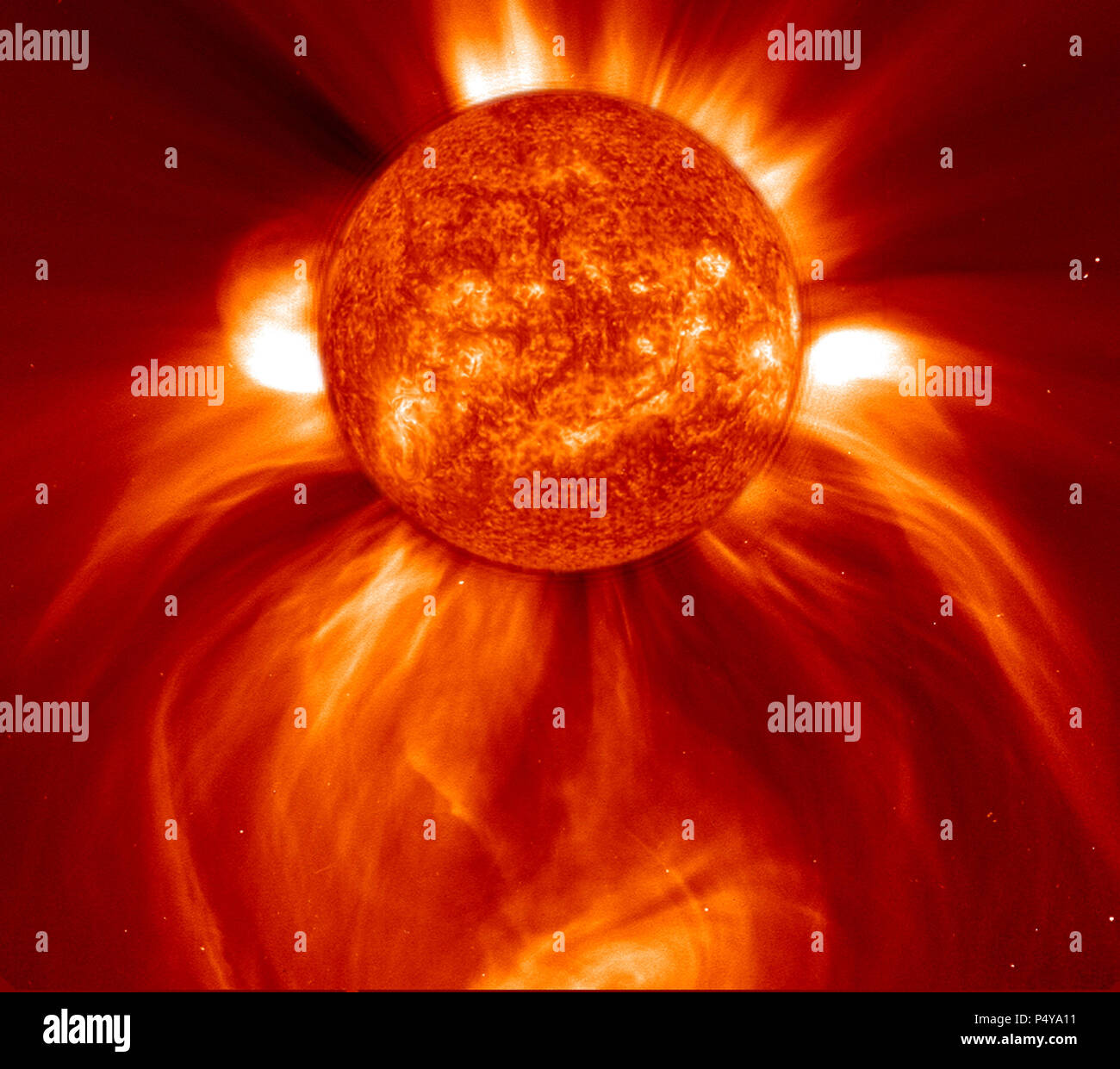 This LASCO C2 image, taken 8 January 2002, shows a widely spreading coronal mass ejection (CME) as it blasts more than a billion tons of matter out into space at millions of kilometers per hour.  Stock Photo