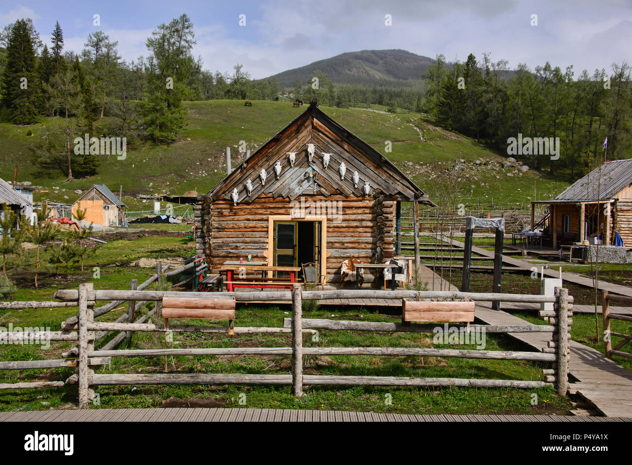Wood home in ethnic Tuvan village, Kanas Lake National Park, Xinjiang, China Stock Photo