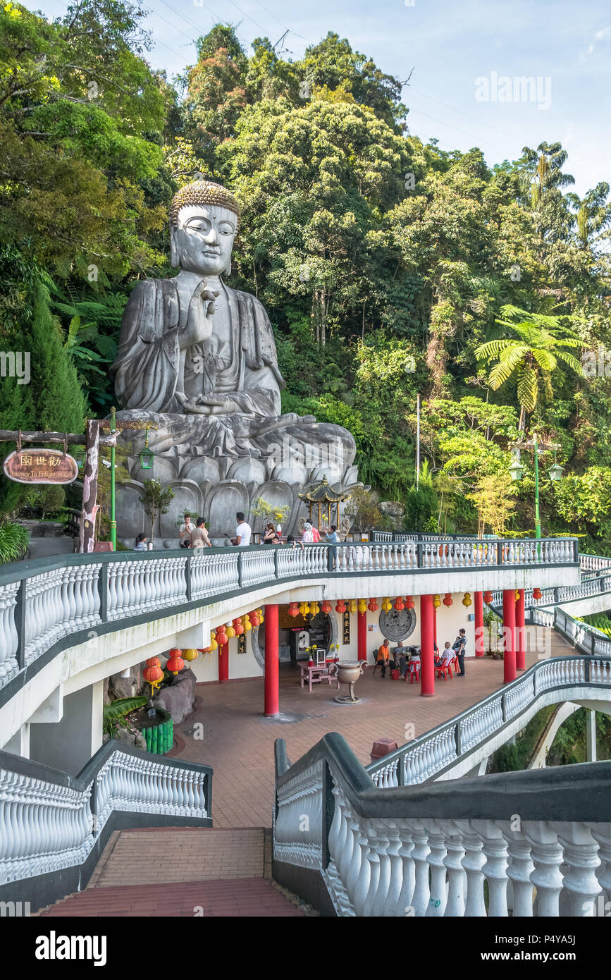 Pahang,Malaysia - Octpber 18,2017 : Stone buddha which is located at Chin Swee Caves Temple,Genting Highlands.People can seen exploring around it. Stock Photo