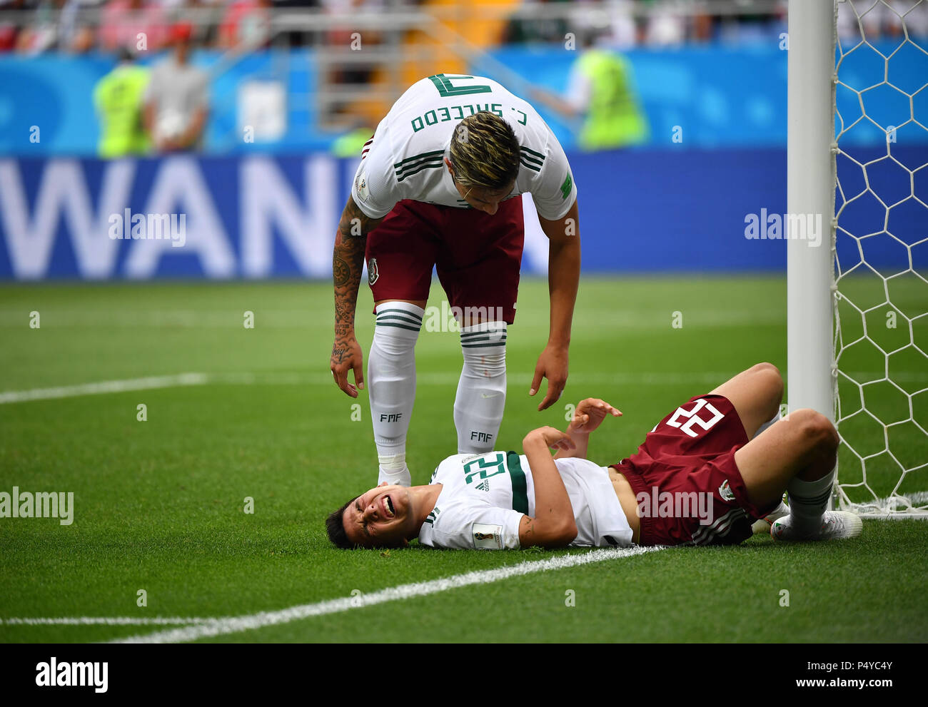 Rostov On Don. 23rd June, 2018. Hirving Lozano (bottom) of Mexico sustains injury during the 2018 FIFA World Cup Group F match between South Korea and Mexico in Rostov-on-Don, Russia, June 23, 2018. Credit: Li Ga/Xinhua/Alamy Live News Stock Photo