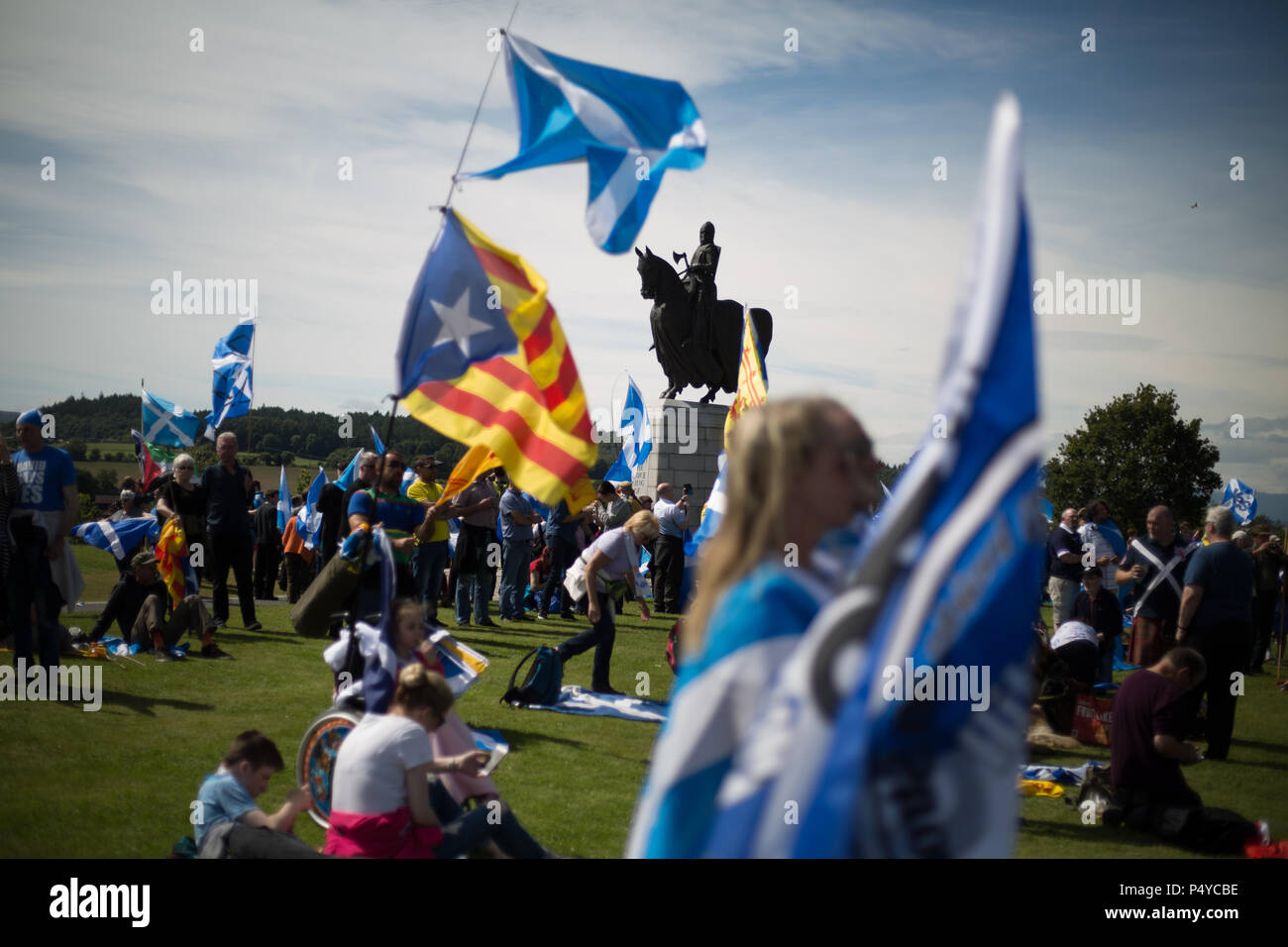 Stirling, Scotland, UK. 23rd June 2018.  Pro-Scottish Independence march, organised in the 'All Under One Banner' name, through the streets and to the battlefield, and statue of King Robert the Bruce,  in Bannockburn on the 704th anniverary of the Battle of Bannockburn. It was estimated that 10,000 people took part in the march calling for a second independence referendum. Photo credit Jeremy Sutton-Hibbert/Alamy Live News. Stock Photo