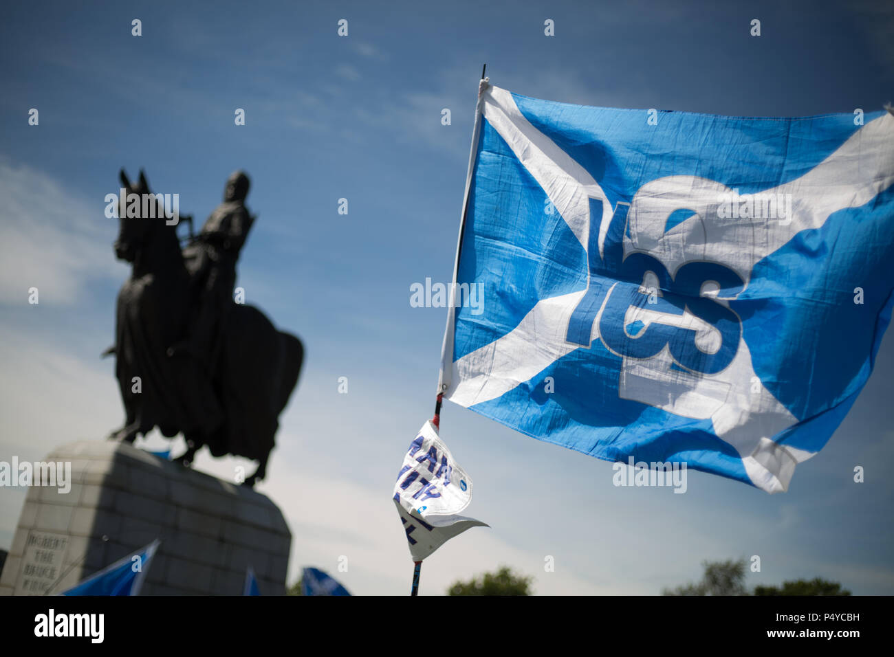 Stirling, Scotland, UK. 23rd June 2018.  Pro-Scottish Independence march, organised in the 'All Under One Banner' name, through the streets and to the battlefield, and statue of King Robert the Bruce,  in Bannockburn on the 704th anniverary of the Battle of Bannockburn. It was estimated that 10,000 people took part in the march calling for a second independence referendum. Photo credit Jeremy Sutton-Hibbert/Alamy Live News. Stock Photo