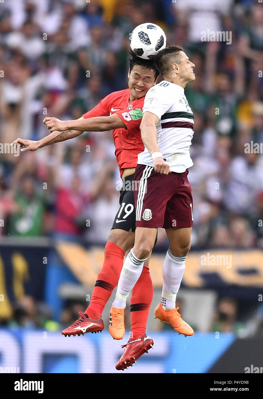 Rostov On Don. 23rd June, 2018. Kim Younggwon (L) of South Korea vies with Javier Hernandez of Mexico during the 2018 FIFA World Cup Group F match between South Korea and Mexico in Rostov-on-Don, Russia, June 23, 2018. Mexico won 2-1. Credit: Chen Yichen/Xinhua/Alamy Live News Stock Photo