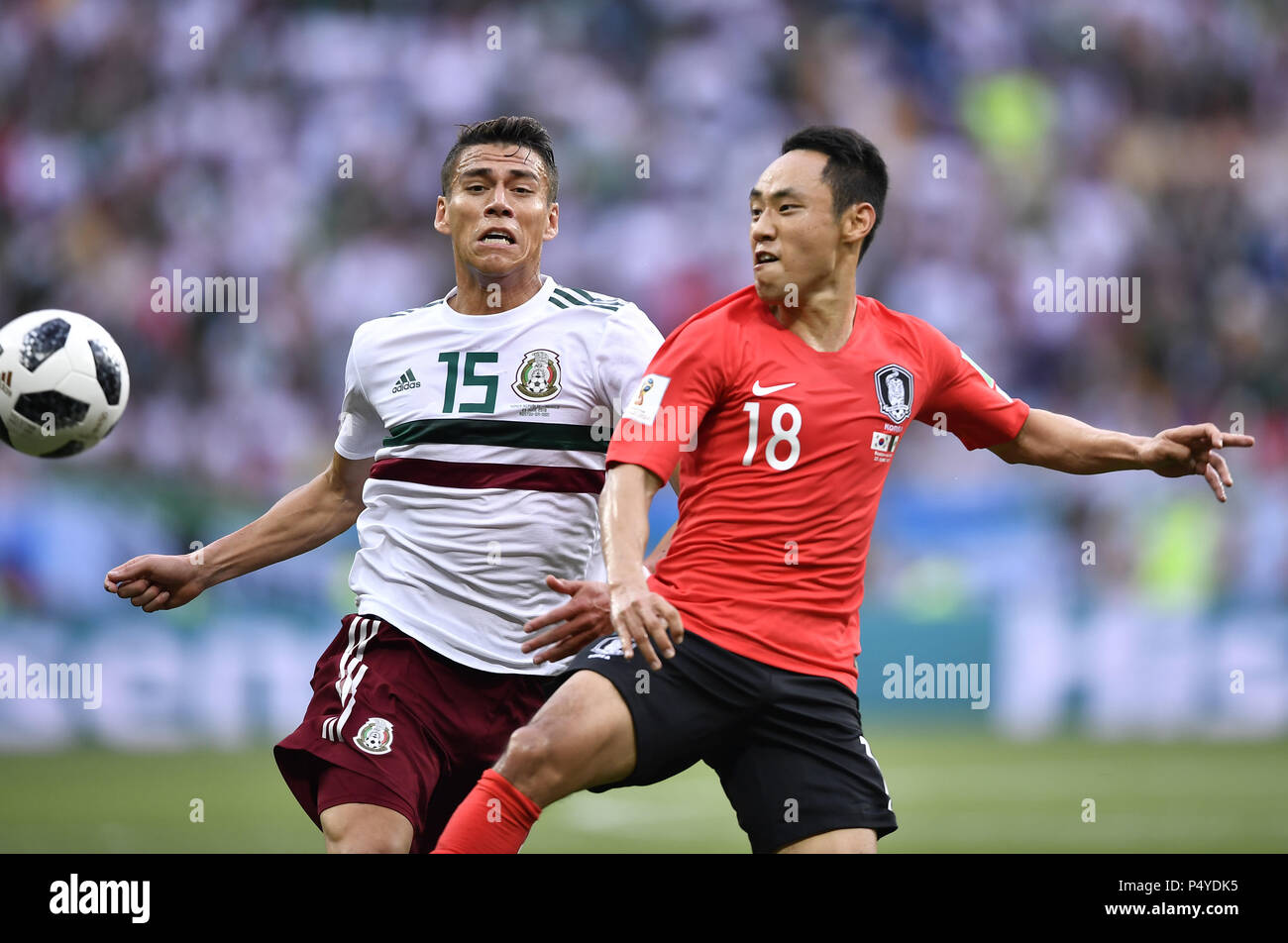 Rostov On Don. 23rd June, 2018. Moon Seonmin (R) of South Korea vies with Hector Moreno of Mexico during the 2018 FIFA World Cup Group F match between South Korea and Mexico in Rostov-on-Don, Russia, June 23, 2018. Credit: Chen Yichen/Xinhua/Alamy Live News Stock Photo