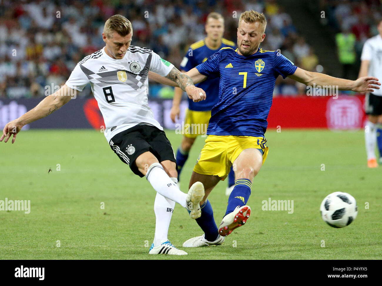 Sochi, Russia. 23rd June, 2018. Sebastian Larsson (R) of Sweden vies with Toni Kroos of Germany during the 2018 FIFA World Cup Group F match between Germany and Sweden in Sochi, Russia, June 23, 2018. Credit: Li Ming/Xinhua/Alamy Live News Stock Photo