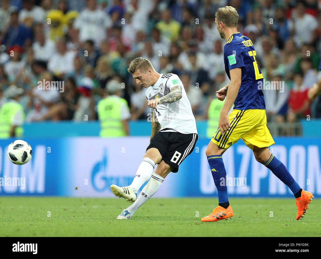 Sochi, Russia. 23rd June, 2018. Toni Kroos (L) of Germany shoots during the 2018 FIFA World Cup Group F match between Germany and Sweden in Sochi, Russia, June 23, 2018. Credit: Fei Maohua/Xinhua/Alamy Live News Stock Photo