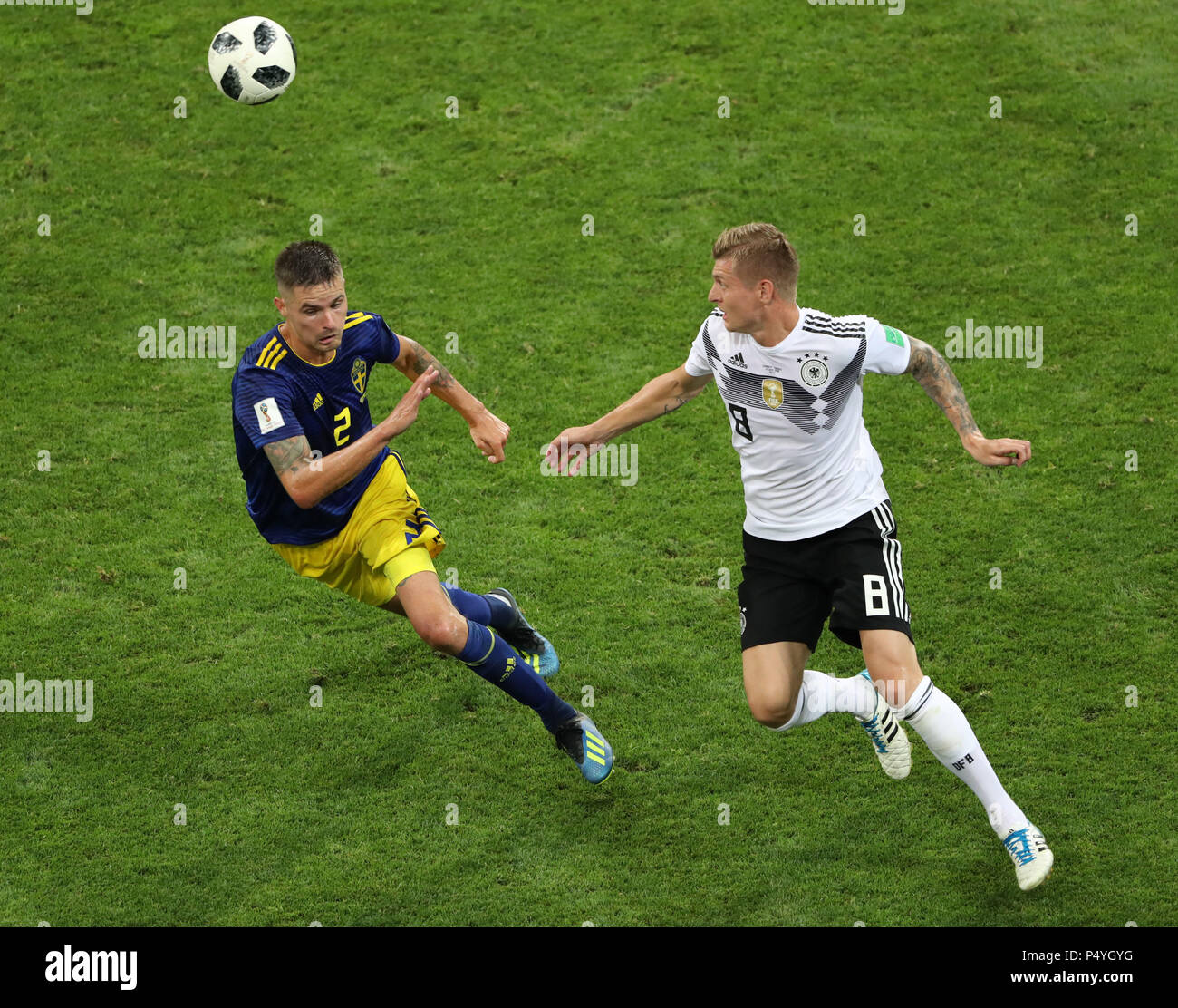 Sochi, Russia. 23rd June, 2018. Toni Kroos (R) of Germany vies with Mikael Lustig of Sweden during the 2018 FIFA World Cup Group F match between Germany and Sweden in Sochi, Russia, June 23, 2018. Credit: Ye Pingfan/Xinhua/Alamy Live News Stock Photo