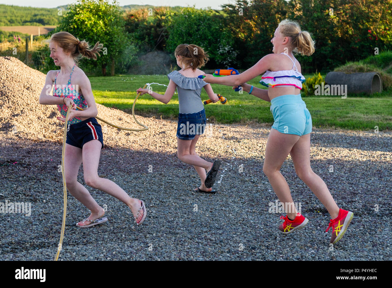 After A Very Day In West Cork 3 Girls Have A Water Fight In A Domestic Garden Temperatures Are Set To Rise Over The Next Few After A Very Day In West Cork 3 Girls Have A Water Fight In A Domestic Garden Temperatures Are Set To Rise Over The Next Few
