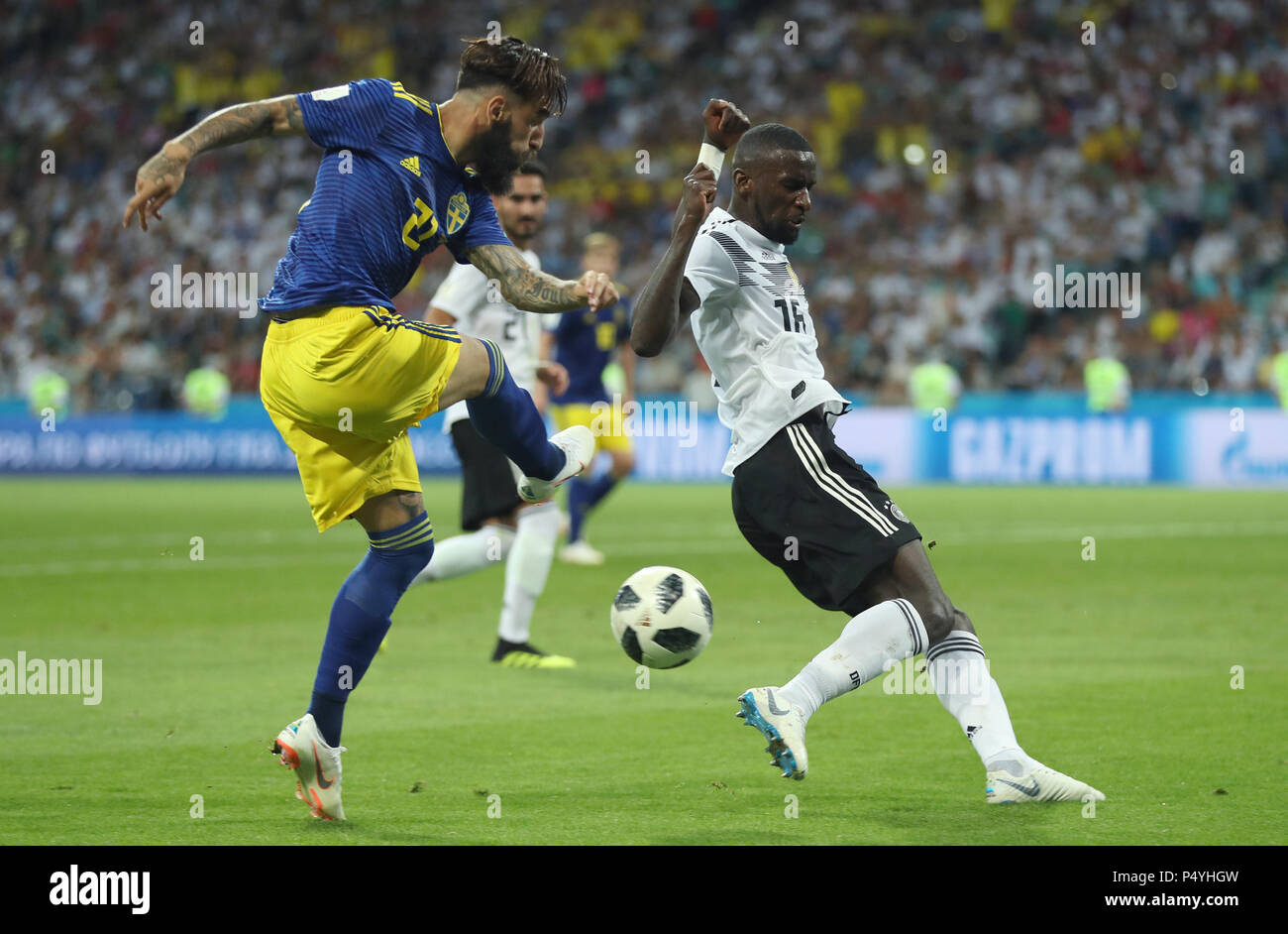 Sochi, Russia. 23rd June, 2018. Jimmy Durmaz (L) of Sweden vies with Antonio Ruediger of Germany during the 2018 FIFA World Cup Group F match between Germany and Sweden in Sochi, Russia, June 23, 2018. Germany won 2-1. Credit: Fei Maohua/Xinhua/Alamy Live News Stock Photo