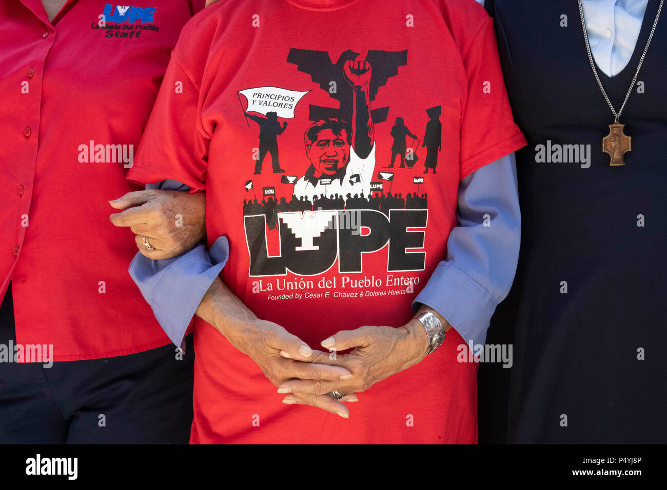 Protesters object to Pres. Donald Trump's immigration policies, particularly separating immigrant families at the border, during a rally on the U.S.-Mexican border in McAllen, Texas. Stock Photo