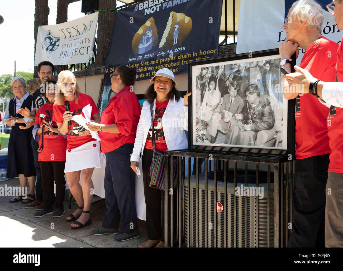 With a photo of her late father on display, Kerry Kennedy (with microphone), director of the Robert F. Kennedy Center for Justice and daughter of Robert and Ethel Kennedy, kicks off a 24-day hunger strike protesting Pres. Donald Trump's immigration policies during a rally on the U.S.-Mexican border in McAllen, Texas. Stock Photo