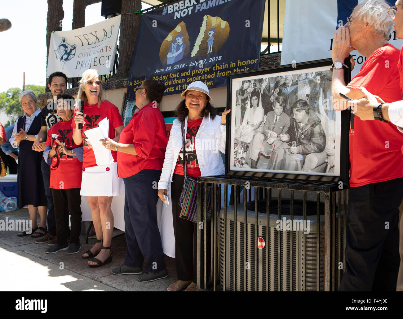 With a photo of her late father on display, Kerry Kennedy (with microphone), director of the Robert F. Kennedy Center for Justice and daughter of Robert and Ethel Kennedy, kicks off a 24-day hunger strike protesting Pres. Donald Trump's immigration policies during a rally on the U.S.-Mexican border in McAllen, Texas. Stock Photo