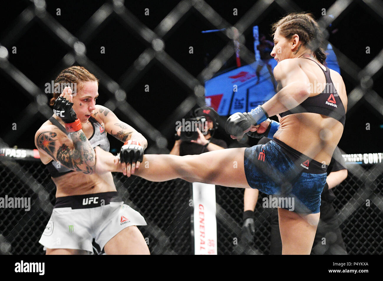 Singapore. 23rd June, 2018. Jessica Eye (R) of the United States fights with Jessica-Rose Clark of Australia during the flyweight bout at the Ultimate Fighting Championship (UFC) in Singapore June 23, 2018. Credit: Then Chih Wey/Xinhua/Alamy Live News Stock Photo