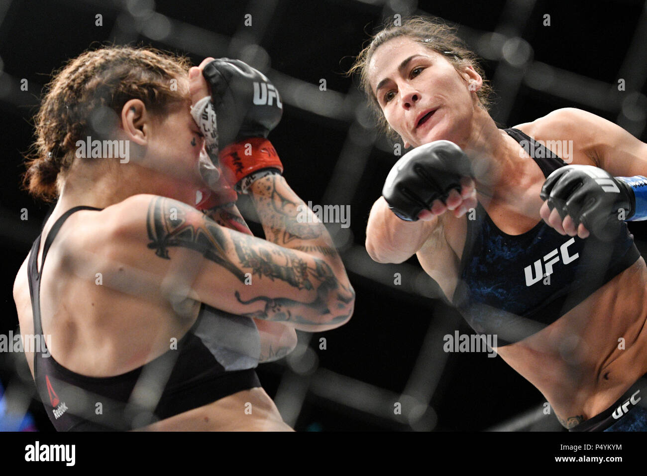 Singapore. 23rd June, 2018. Jessica Eye (R) of the United States fights with Jessica-Rose Clark of Australia during the flyweight bout at the Ultimate Fighting Championship (UFC) in Singapore June 23, 2018. Credit: Then Chih Wey/Xinhua/Alamy Live News Stock Photo
