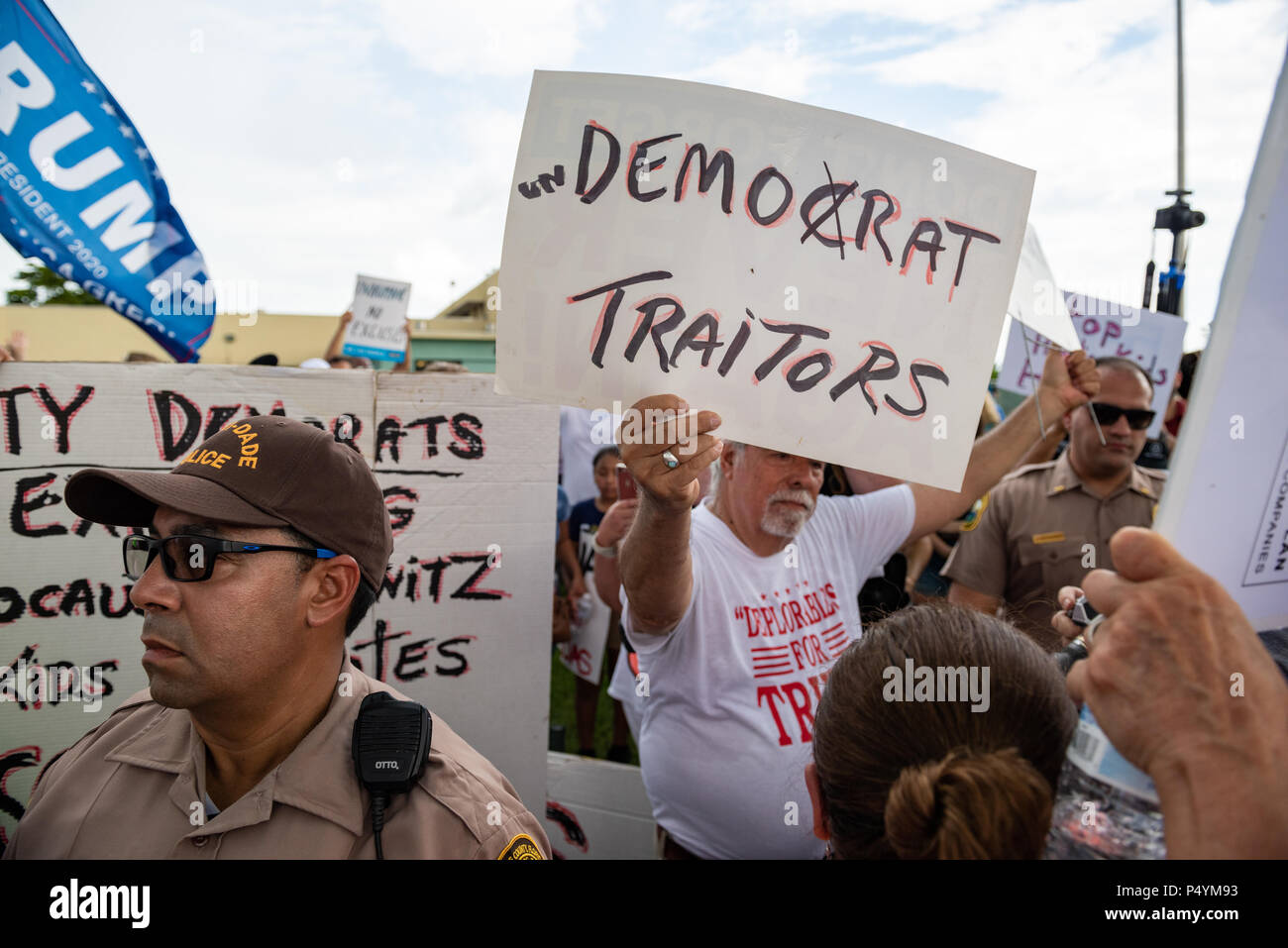 Miami, USA. 23rd June 2018. Trump supporter outside Homestead Temporary Shelter for Unaccompanied Children facing protesters against Trumps family separation policy. William C. Bunce/Alamy Live News Stock Photo