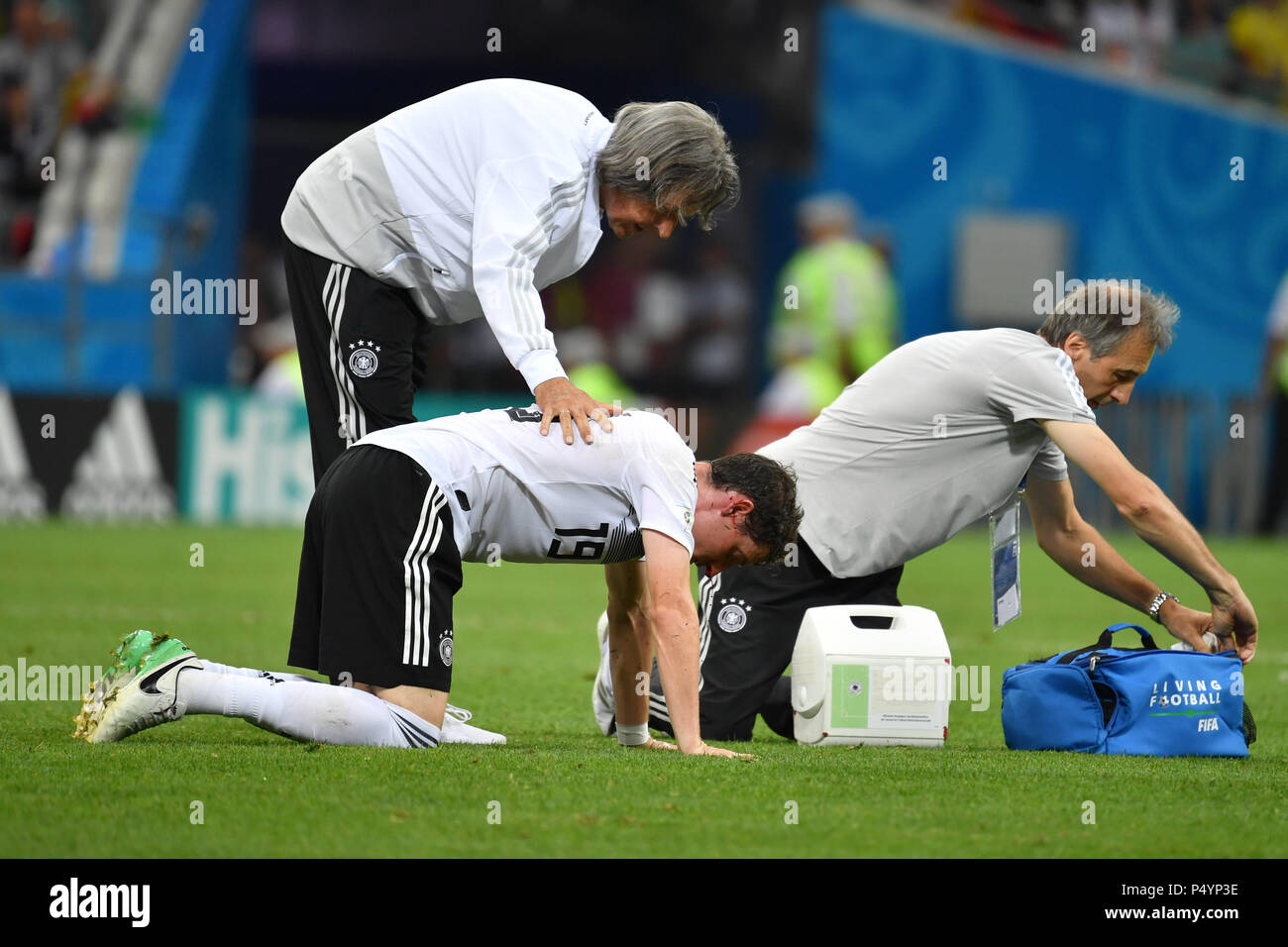 Sochi, Russia. 23rd June, 2018. Hans Wilhelm MUELLER WOHLFAHRT (team doctor) takes care of the bleeding Sebastian RUDY (GER), injured, injury, Germany (GER) -Sweden (SWE) 2-1, preliminary round, group F, game 27, on 23/06/2018 in SOCHI, Fisht Olymipic Stadium. Football World Cup 2018 in Russia from 14.06. - 15.07.2018. | usage worldwide Credit: dpa/Alamy Live News Stock Photo