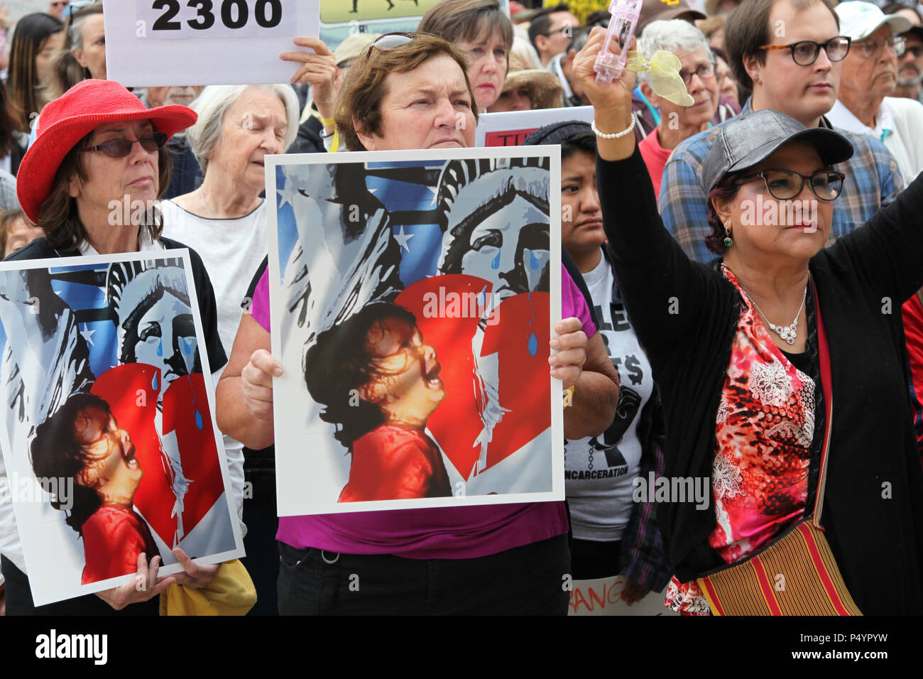 San Diego, USA. 23rd June, 2018. People take part in the 'Families Belong Together' protest in San Diego, the United States, on June 23, 2018. Thousands of people marched in protest in the U.S.-Mexico border city of San Diego on Saturday, raising slogans against the Trump administration's policy of separating children from immigrant parents. Credit: Gao Shan/Xinhua/Alamy Live News Stock Photo