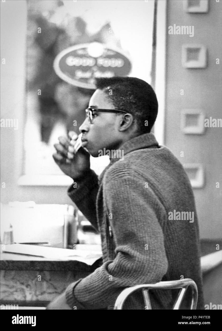 Benjamin Cowins during a sit-in at McCrory's lunch counter in Tallahassee, Florida on February 21, 1961. A group of Florida A&M students had been arrested a year earlier after a sit-in at a Tallahassee Woolworth's lunch counter. Stock Photo