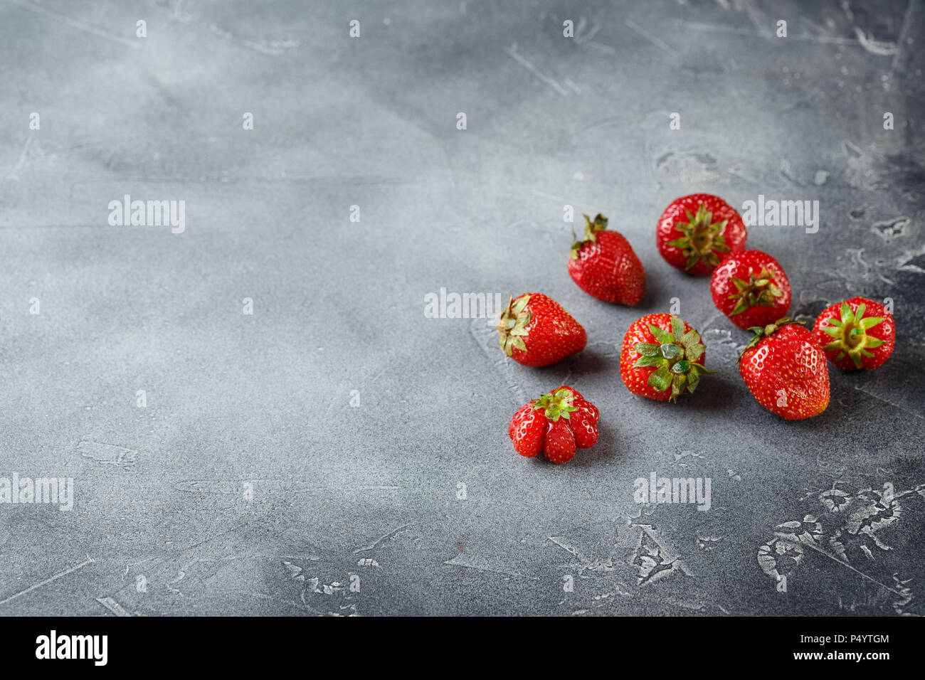 Top of view fresh strawberry on grey concrete background Stock Photo ...