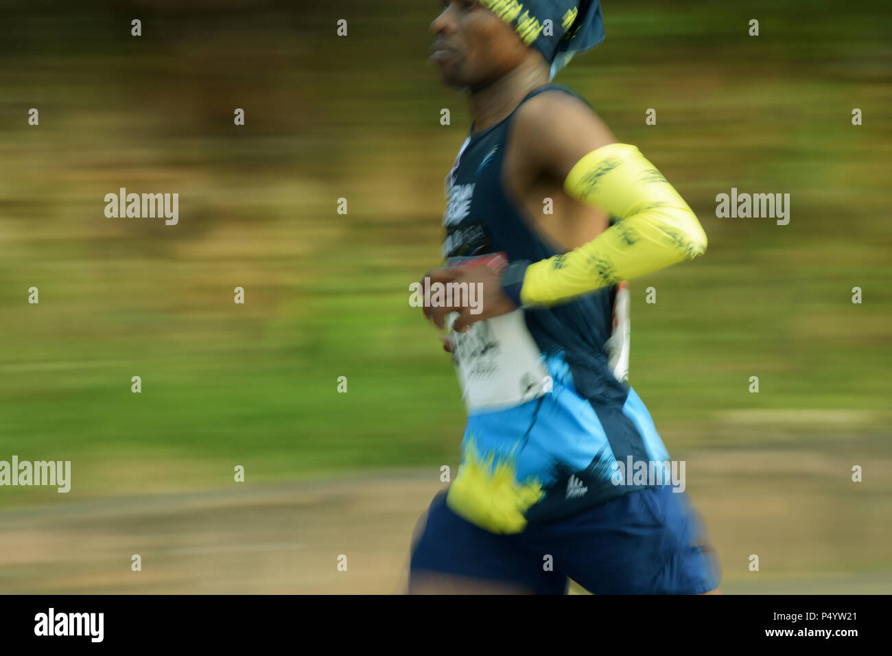 Durban, KwaZulu-Natal, South Africa, adult black man, runner, colourful  sportswear, running, 2018 Comrades Marathon, Valley of 1000 hills, blur  Stock Photo - Alamy