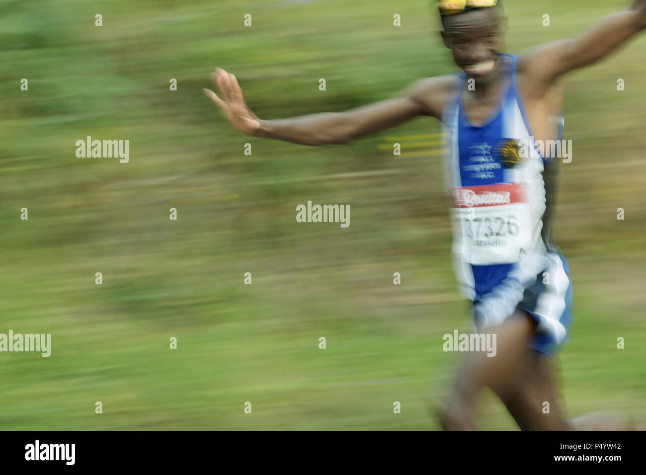 Durban, KwaZulu-Natal, South Africa, blur, black adult man runner joking while running, 2018 Comrades Marathon, people, Valley of 1000 Hills Stock Photo