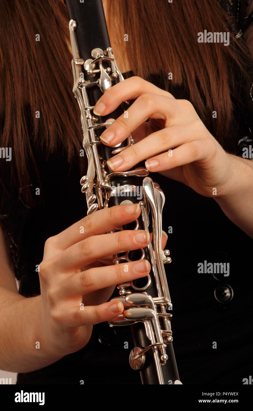 Close up of hands on the keys of her instrument