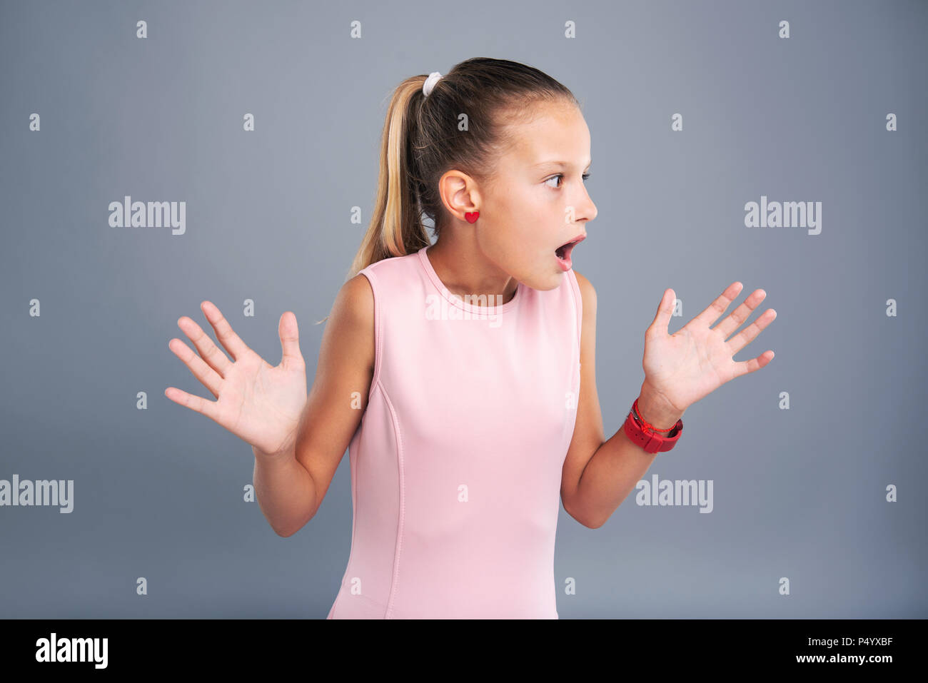 Pleasant teenage girl being scared Stock Photo