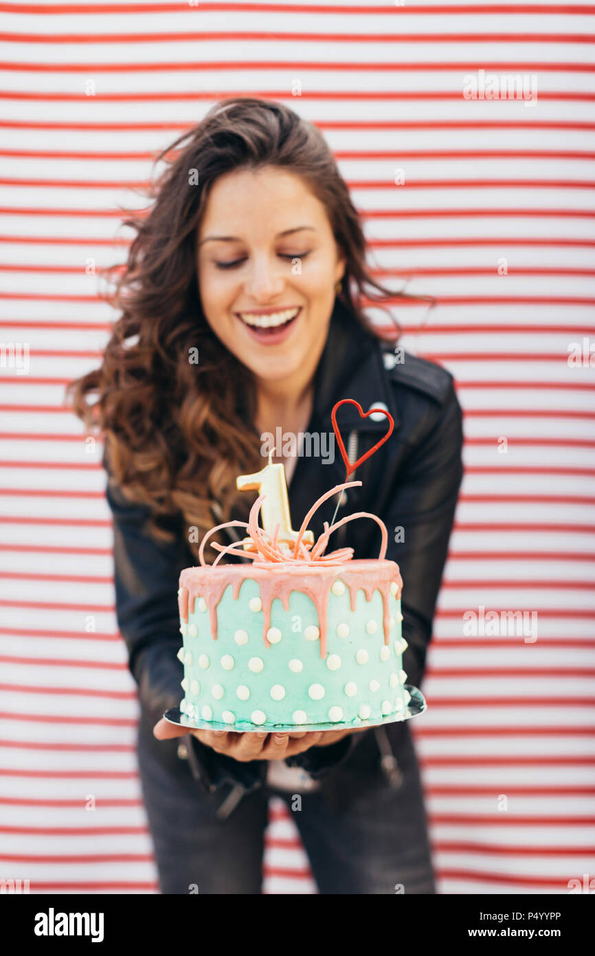 Woman presenting Birthday cake Stock Photo Alamy