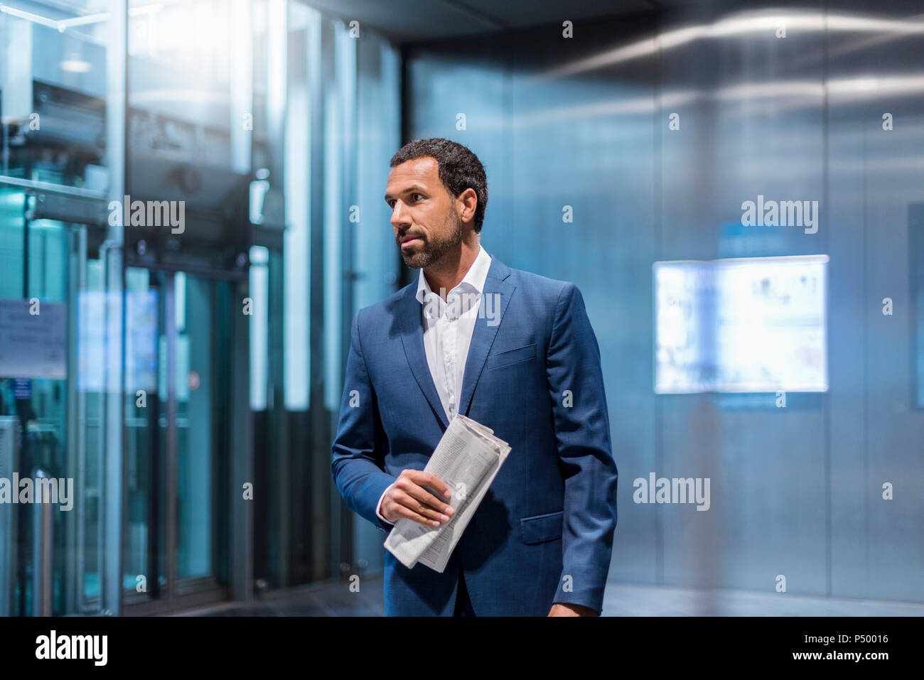 Businessman with newspaper Stock Photo